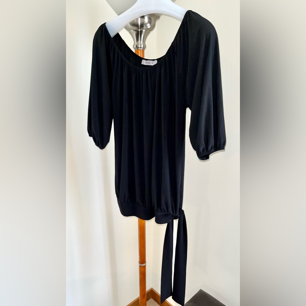 “Only 9" polyester top. Elastic opening so can be pulled off-shoulder. B…